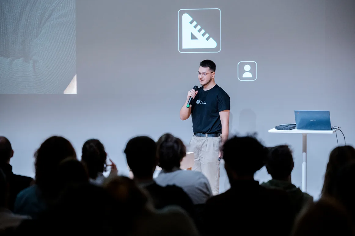 Speaking at the front of a classroom during a presentation