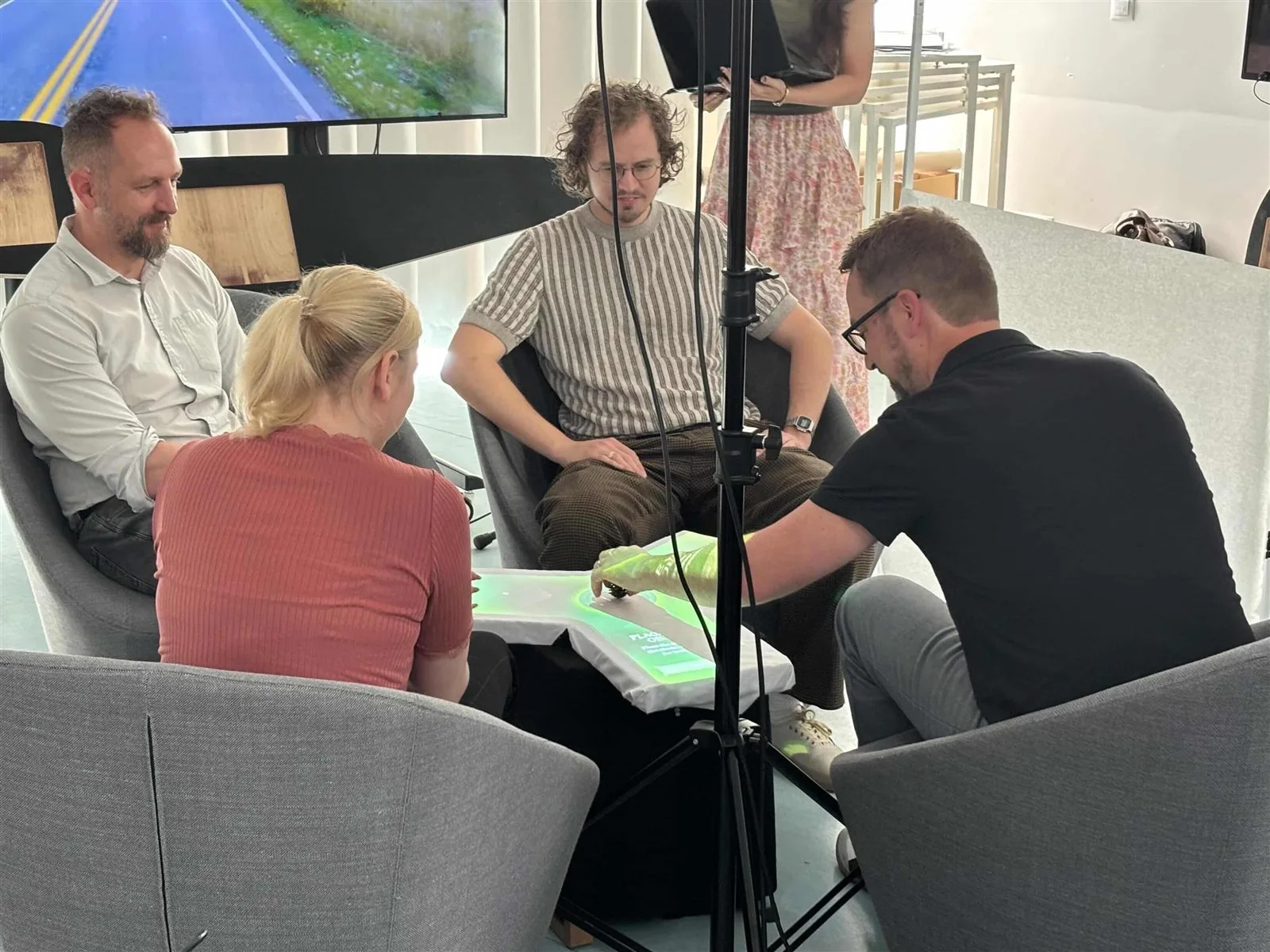 Consultants testing the Mercedes Aura demo together