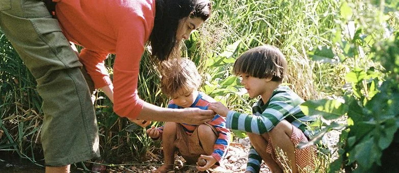 Family collecting natural trinkets outdoors